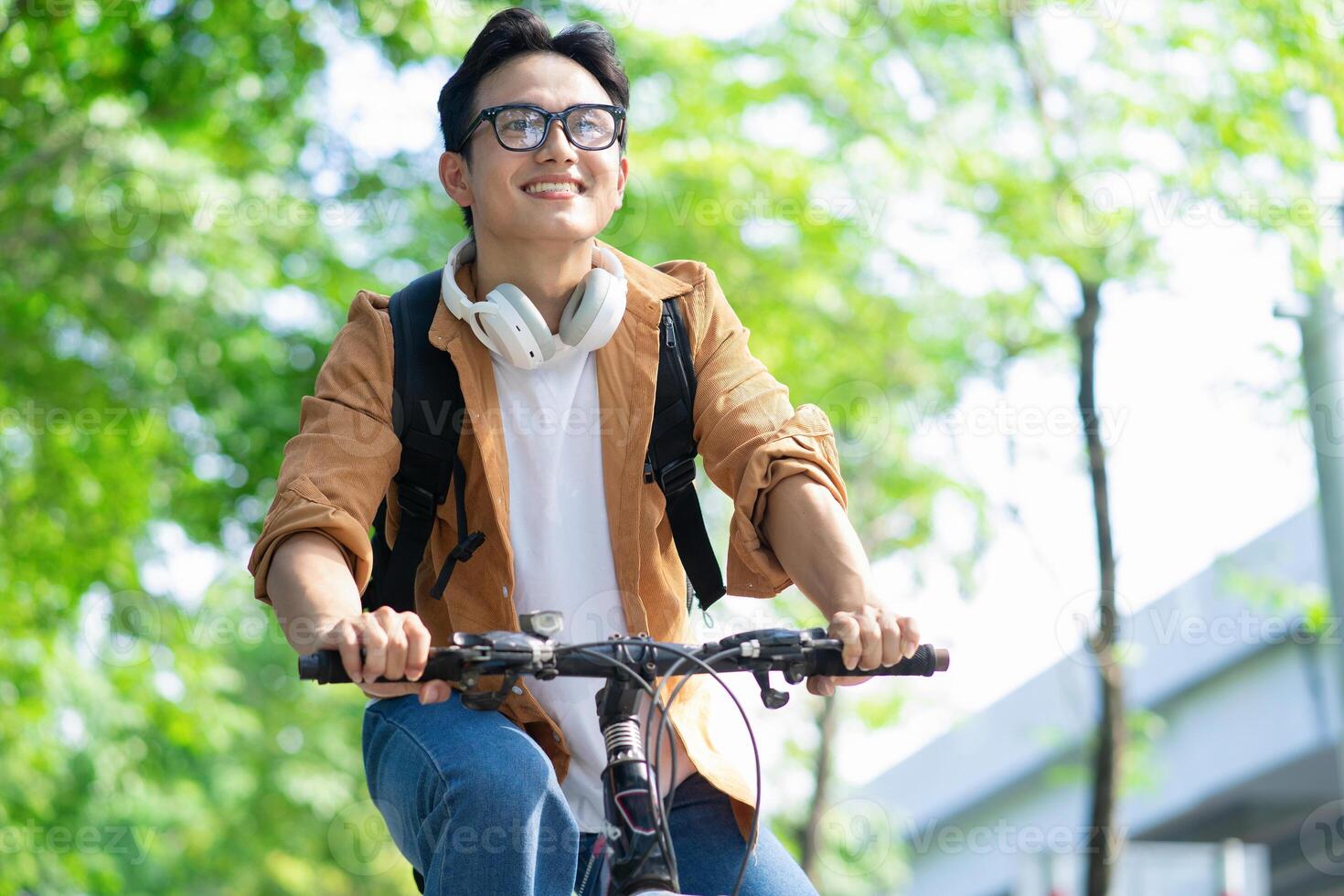 Portrait of young Asian man outside photo