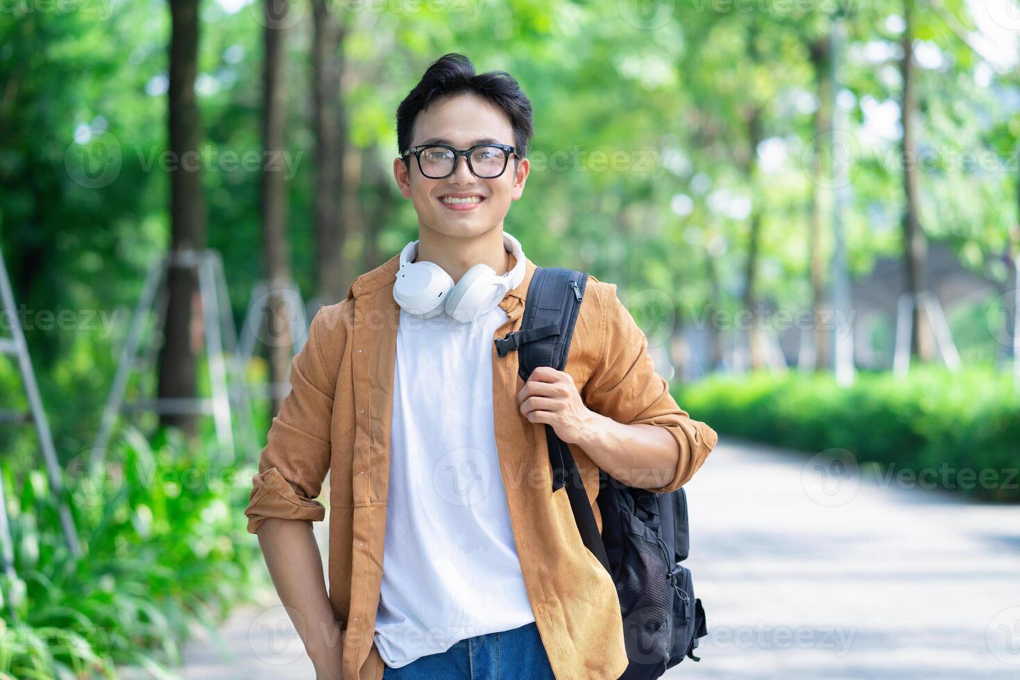 Portrait of young Asian man outside photo