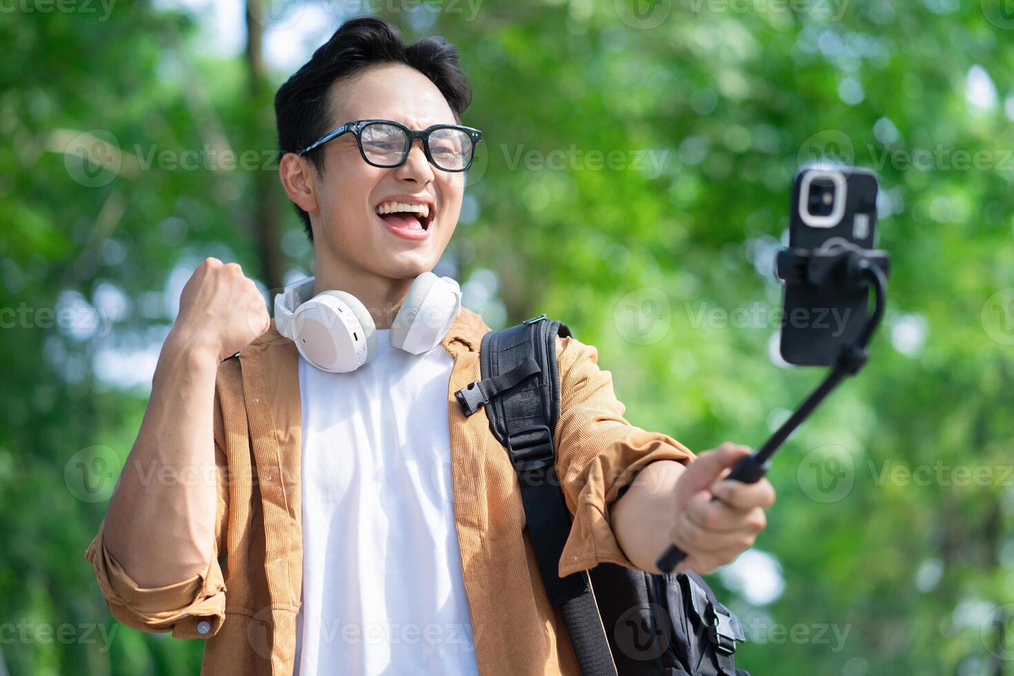 Portrait of young Asian man outside photo