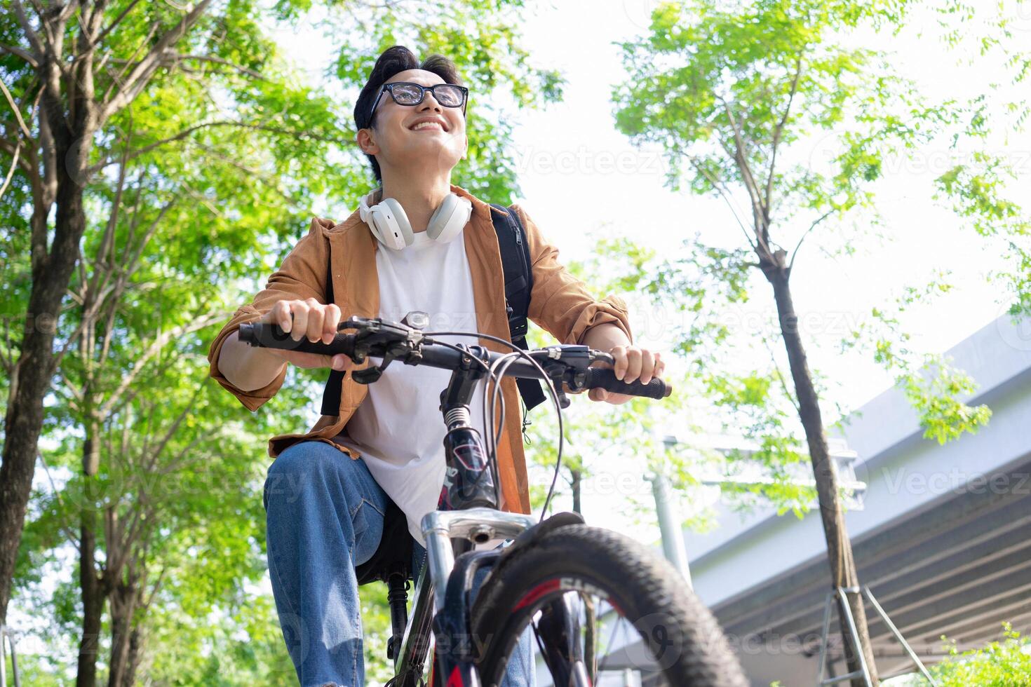 Portrait of young Asian man outside photo
