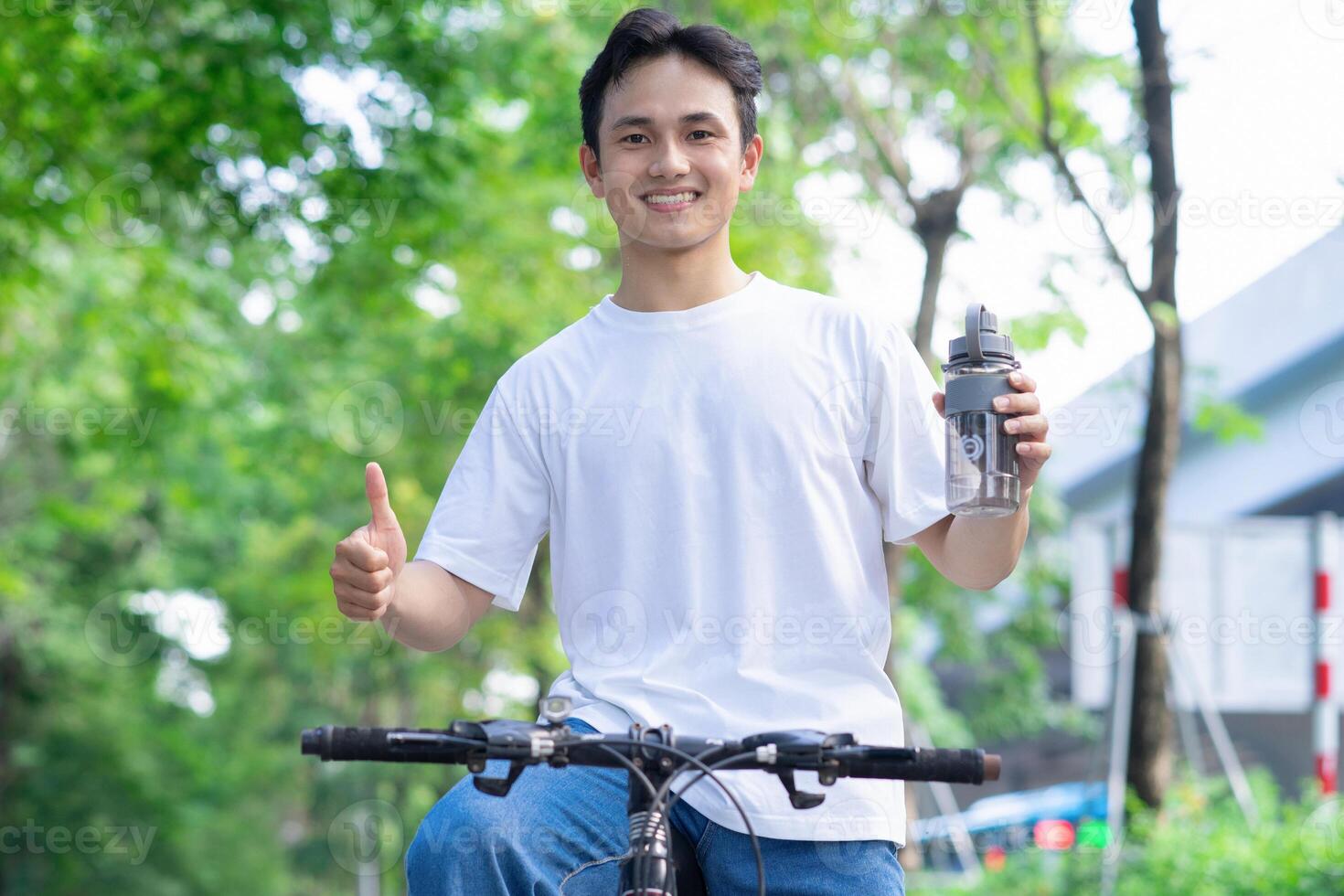 Portrait of young Asian man outside photo