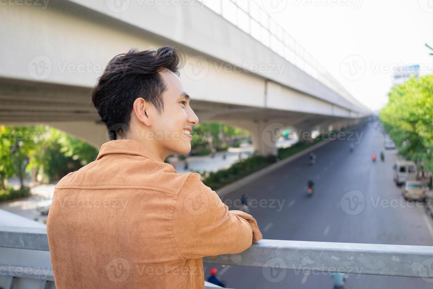 Portrait of young Asian man outside photo