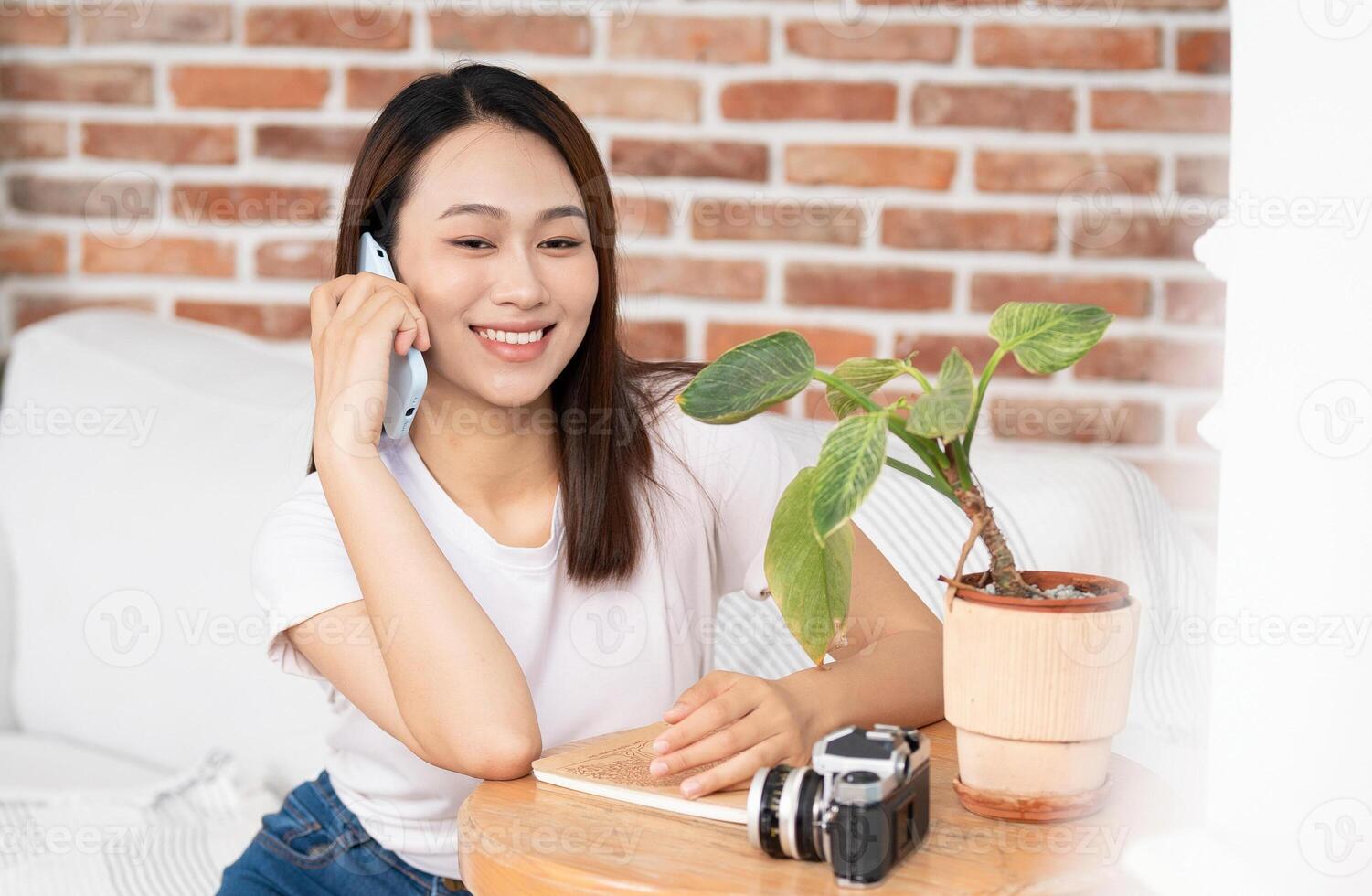 Photo of young Asian woman at home