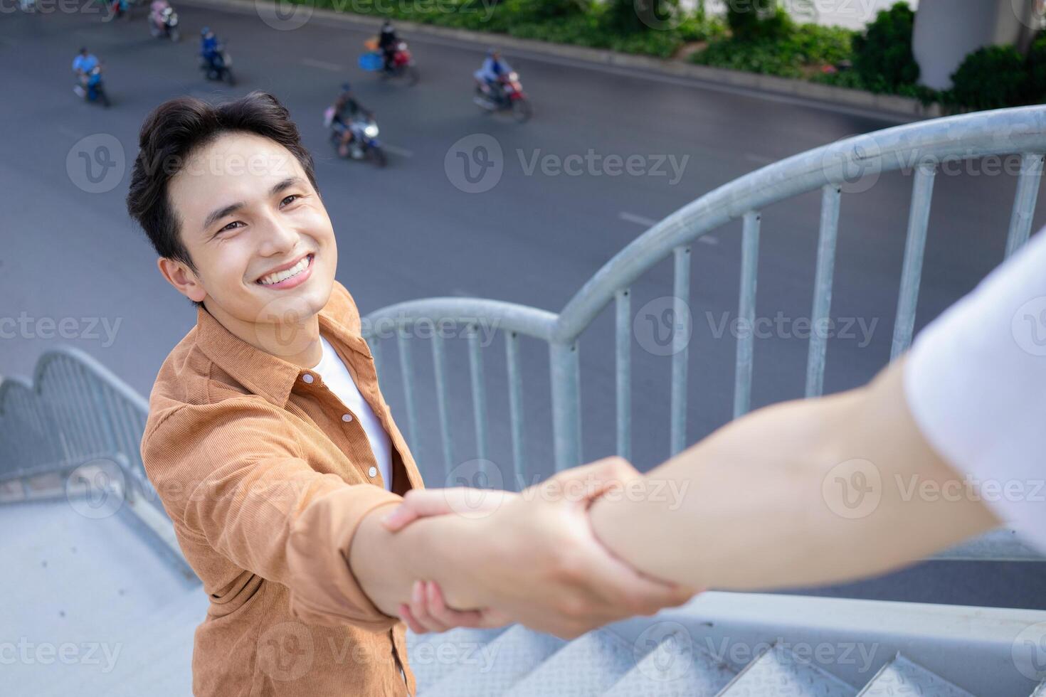 Portrait of young Asian man outside photo