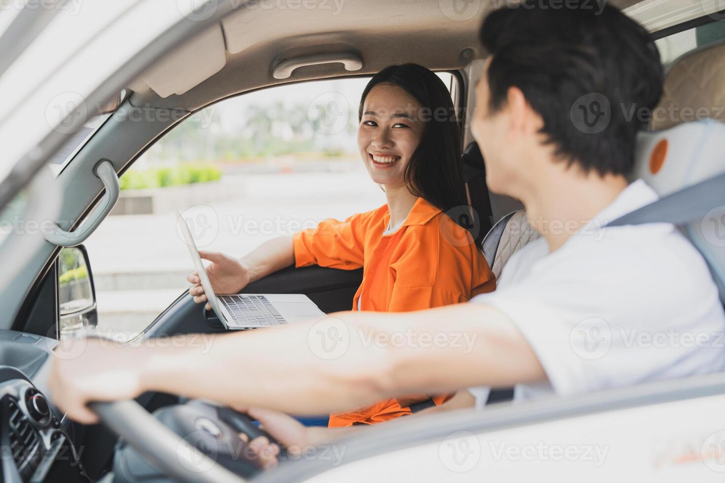 Photo of young Asian couple working together