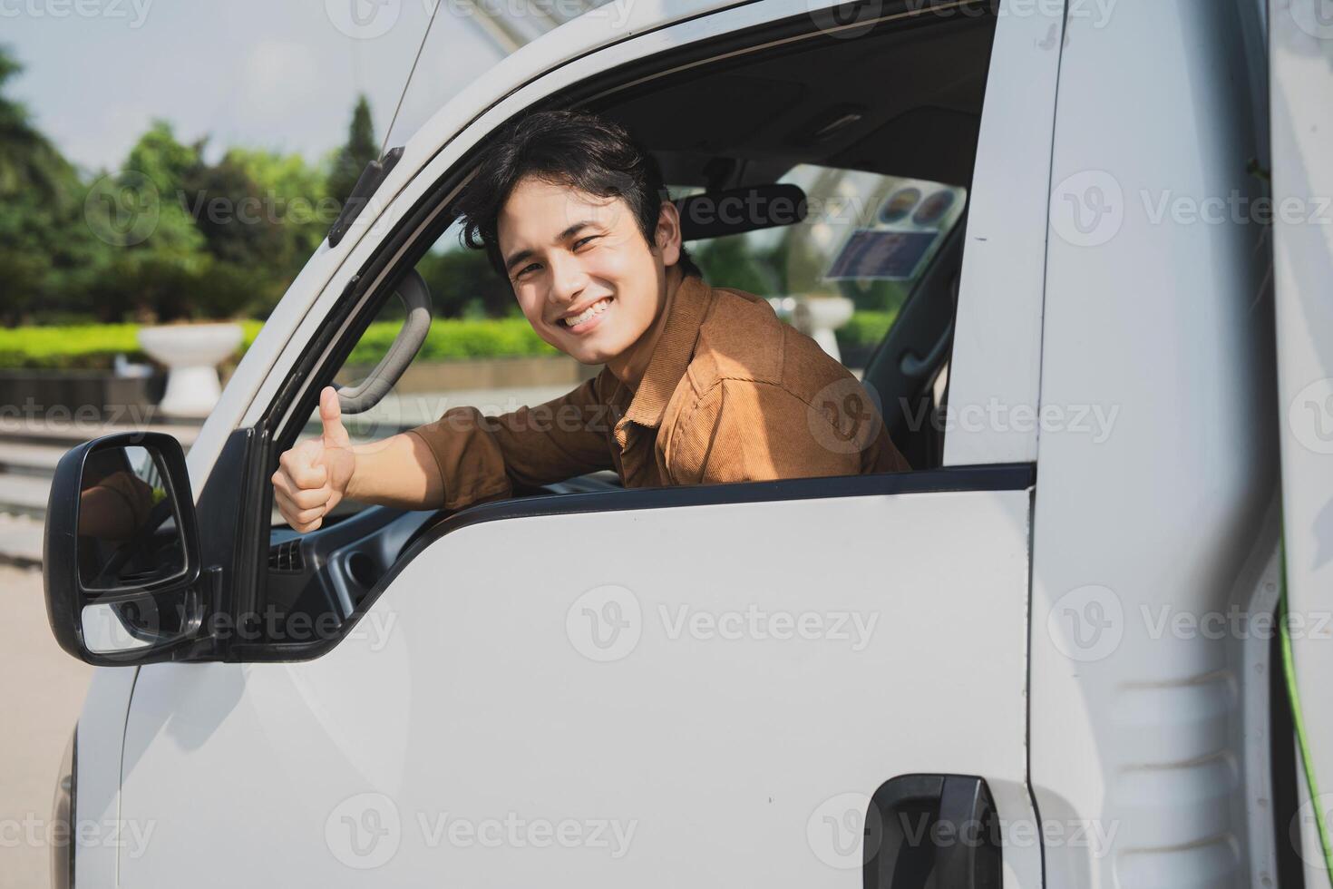 Photo of young Asian man with his truck