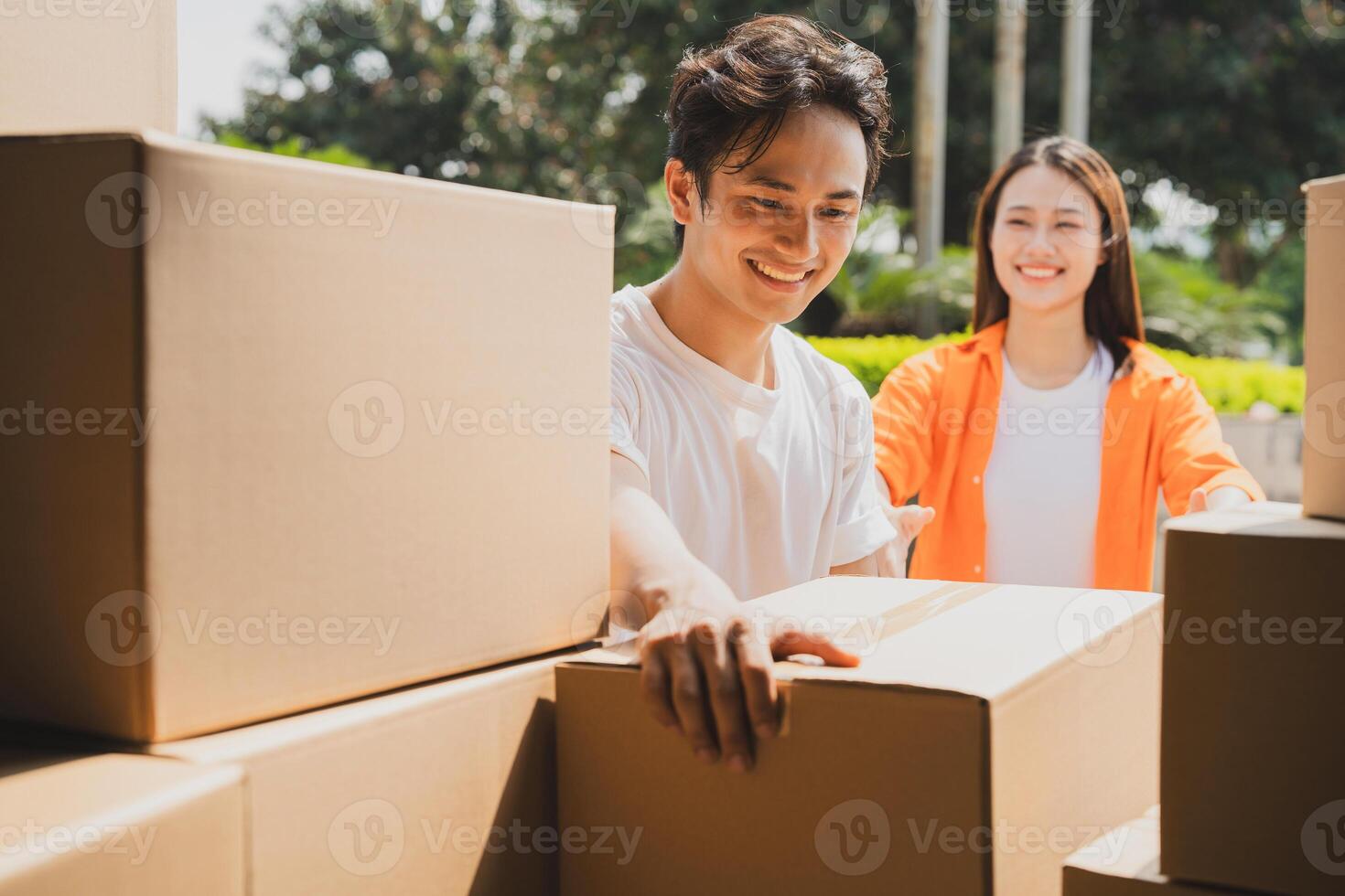 Photo of young Asian couple working together