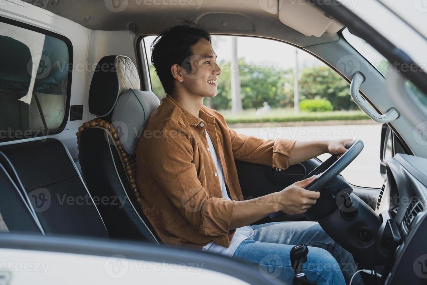 Photo of young Asian man with his truck