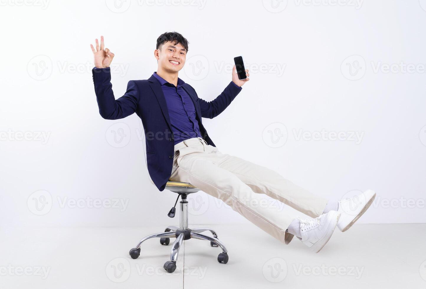 Photo of young Asian businessman on white background