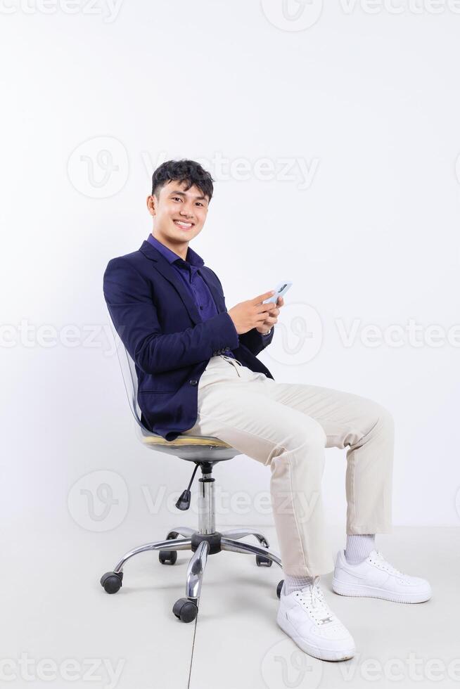 Photo of young Asian businessman on white background