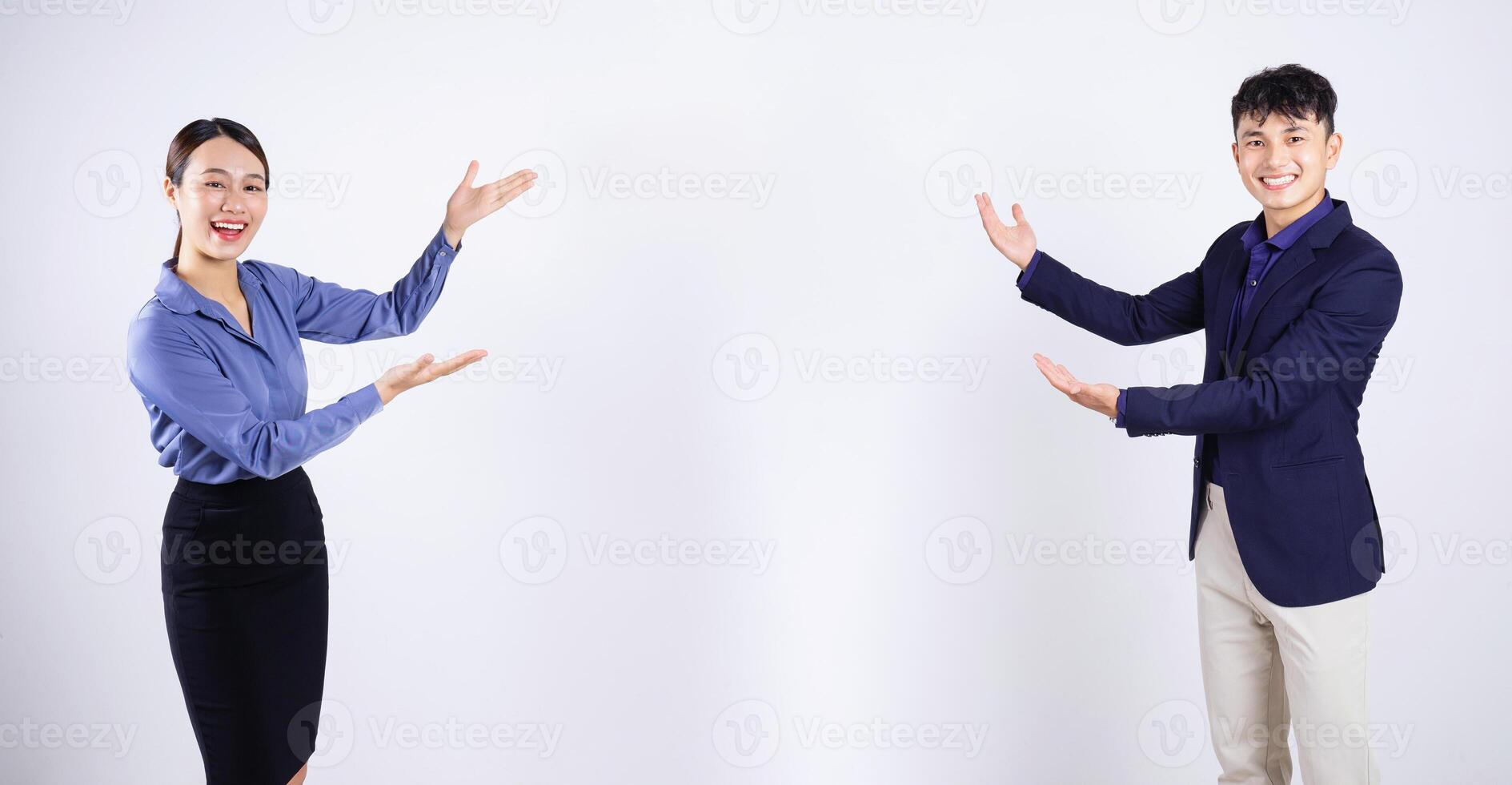 Photo of two young Asian business people on white background