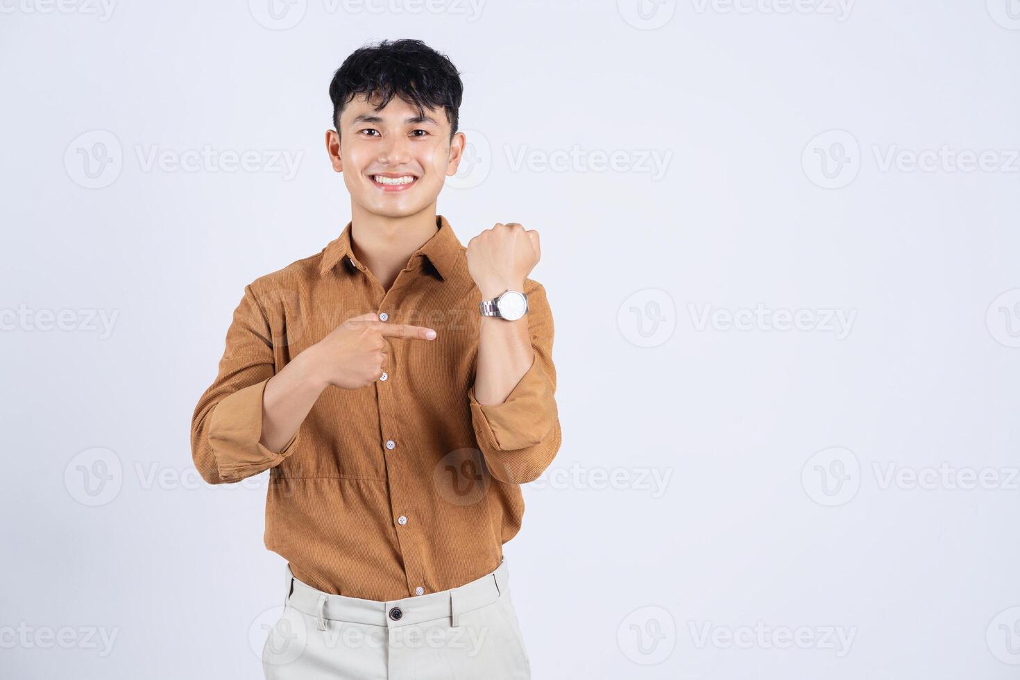 Photo of young Asian businessman on white background