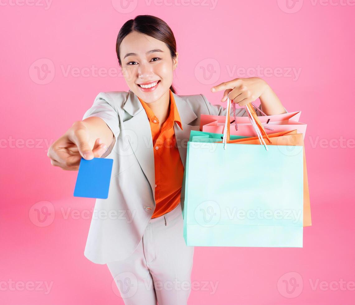 Photo of young Asian businesswoman on background