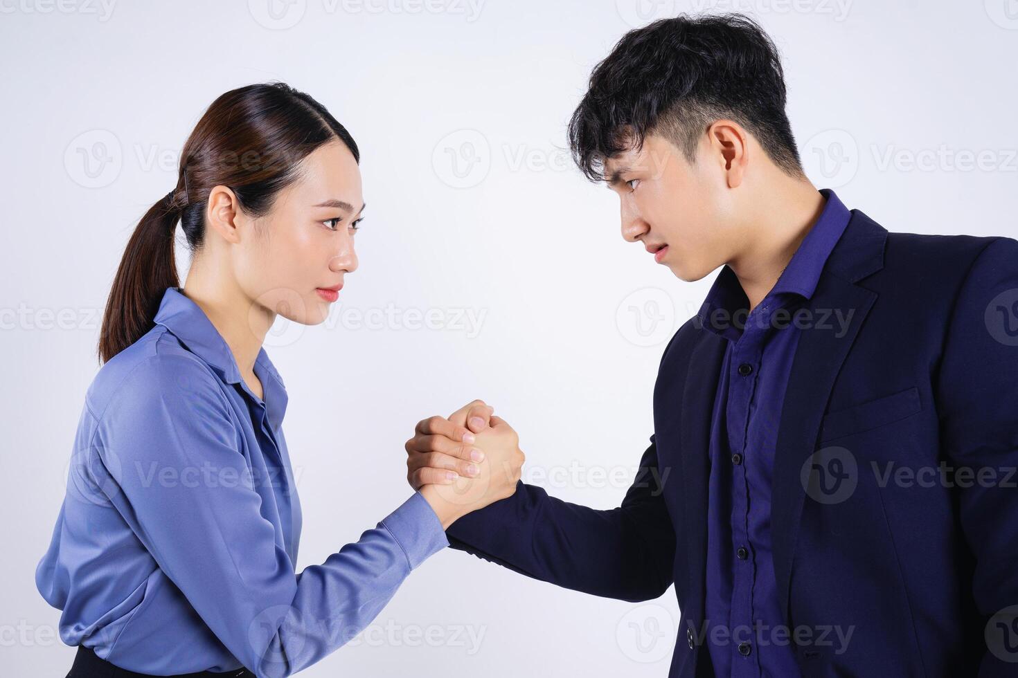 Photo of two young Asian business people on white background