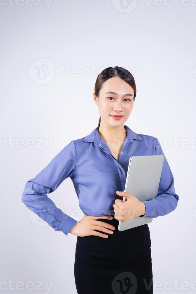 Photo of young Asian businesswoman on white background