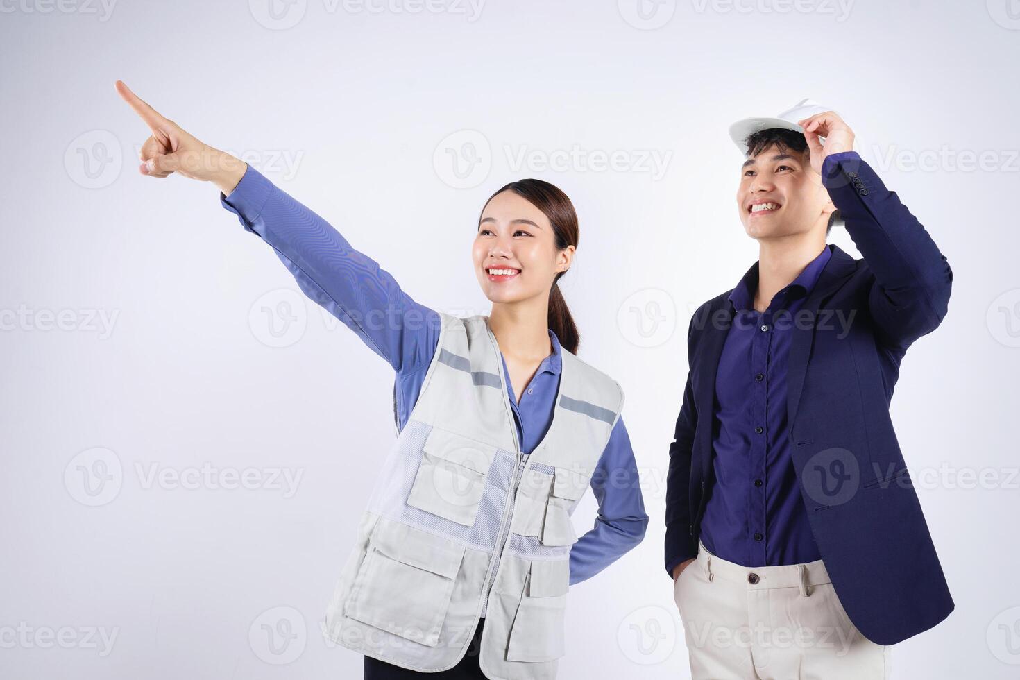 Photo of two young Asian business people on white background