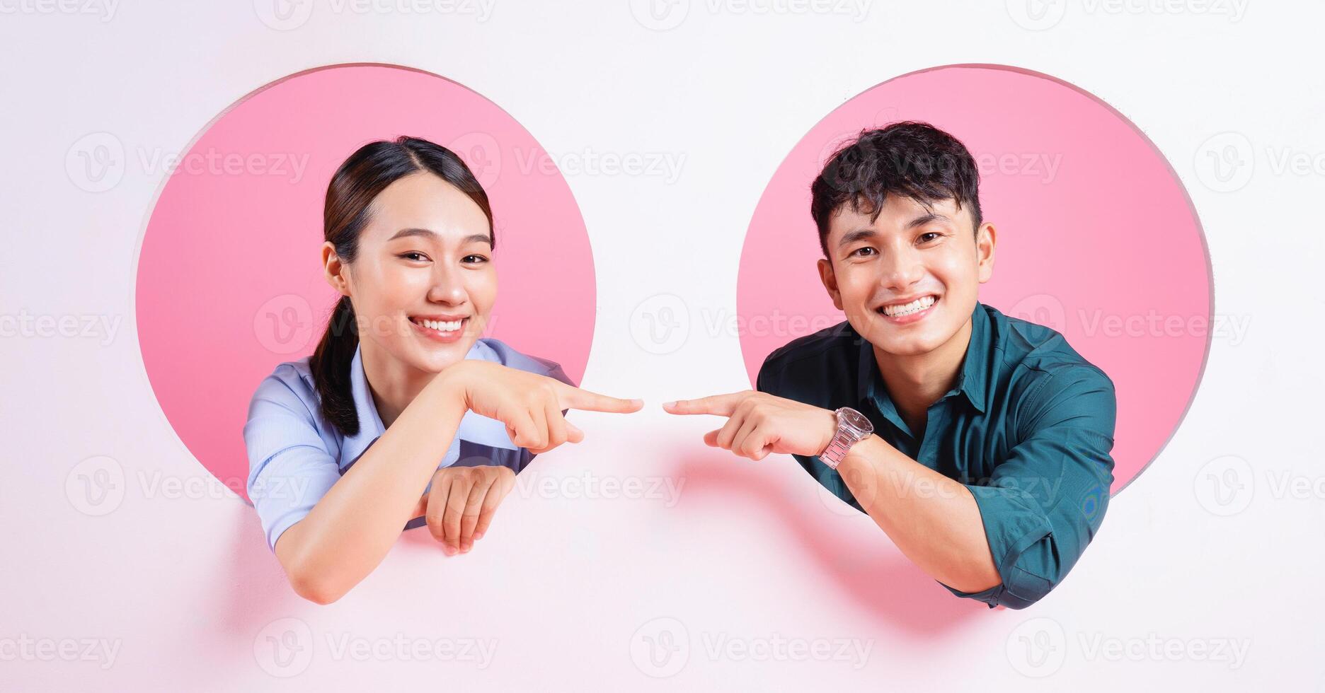 Photo of young Asian couple on background