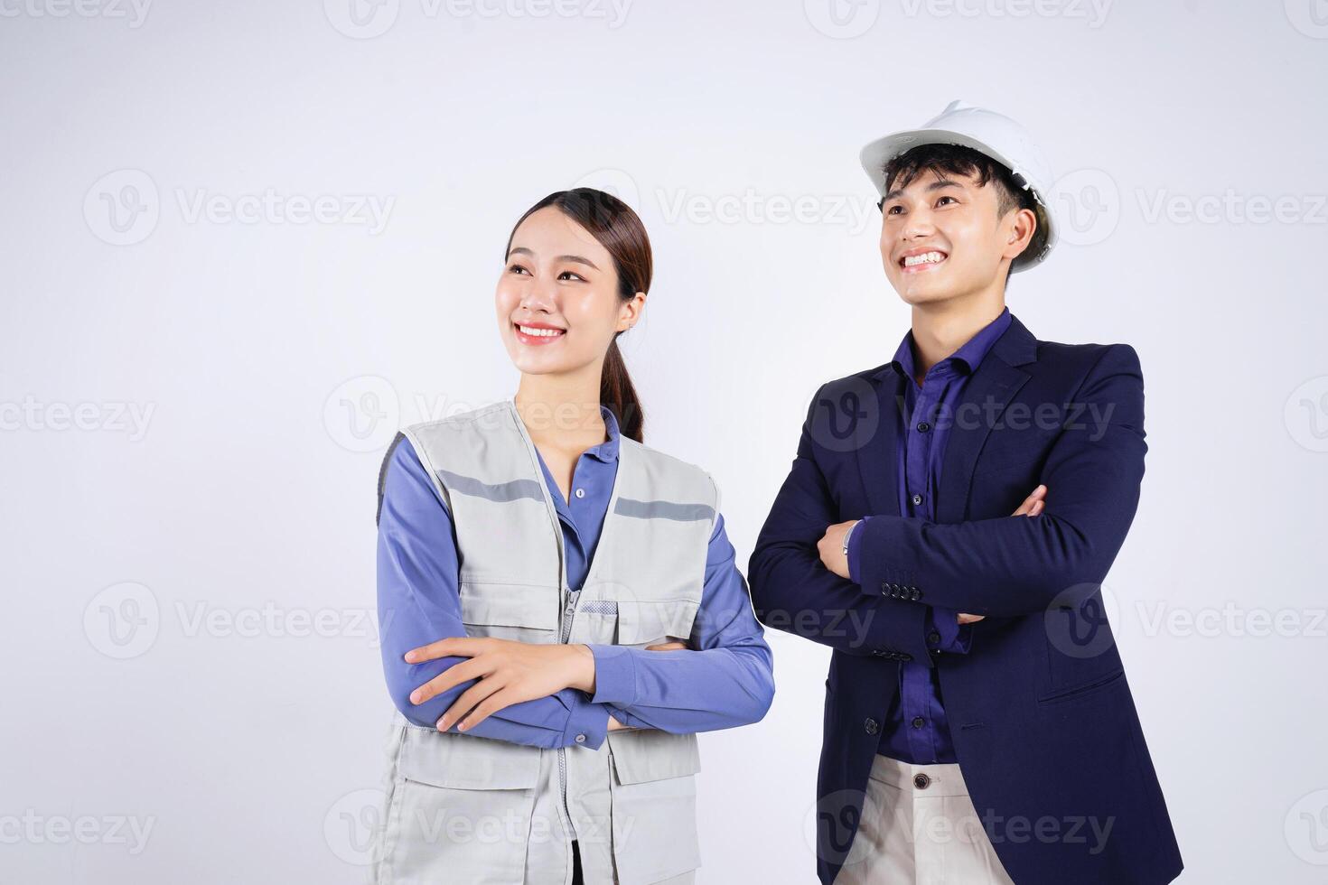 Photo of two young Asian business people on white background