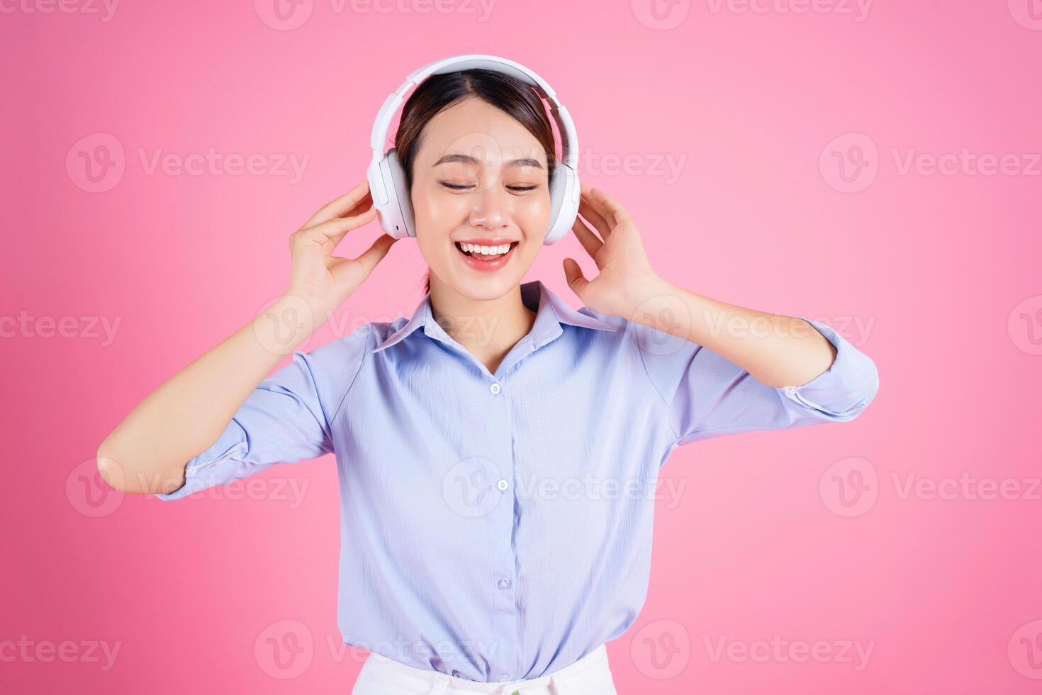 Photo of young Asian woman on background