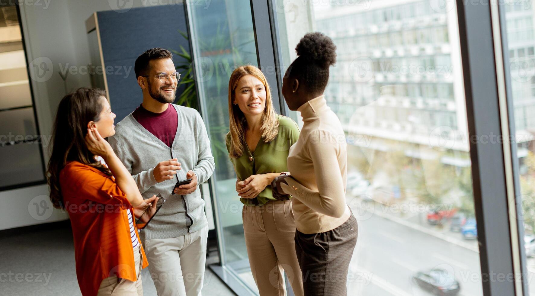 Young multiethnic startup team working in the modern office photo