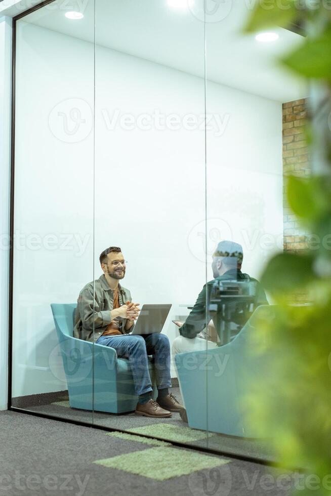 Casual Business Meeting in a Modern Office Lounge photo