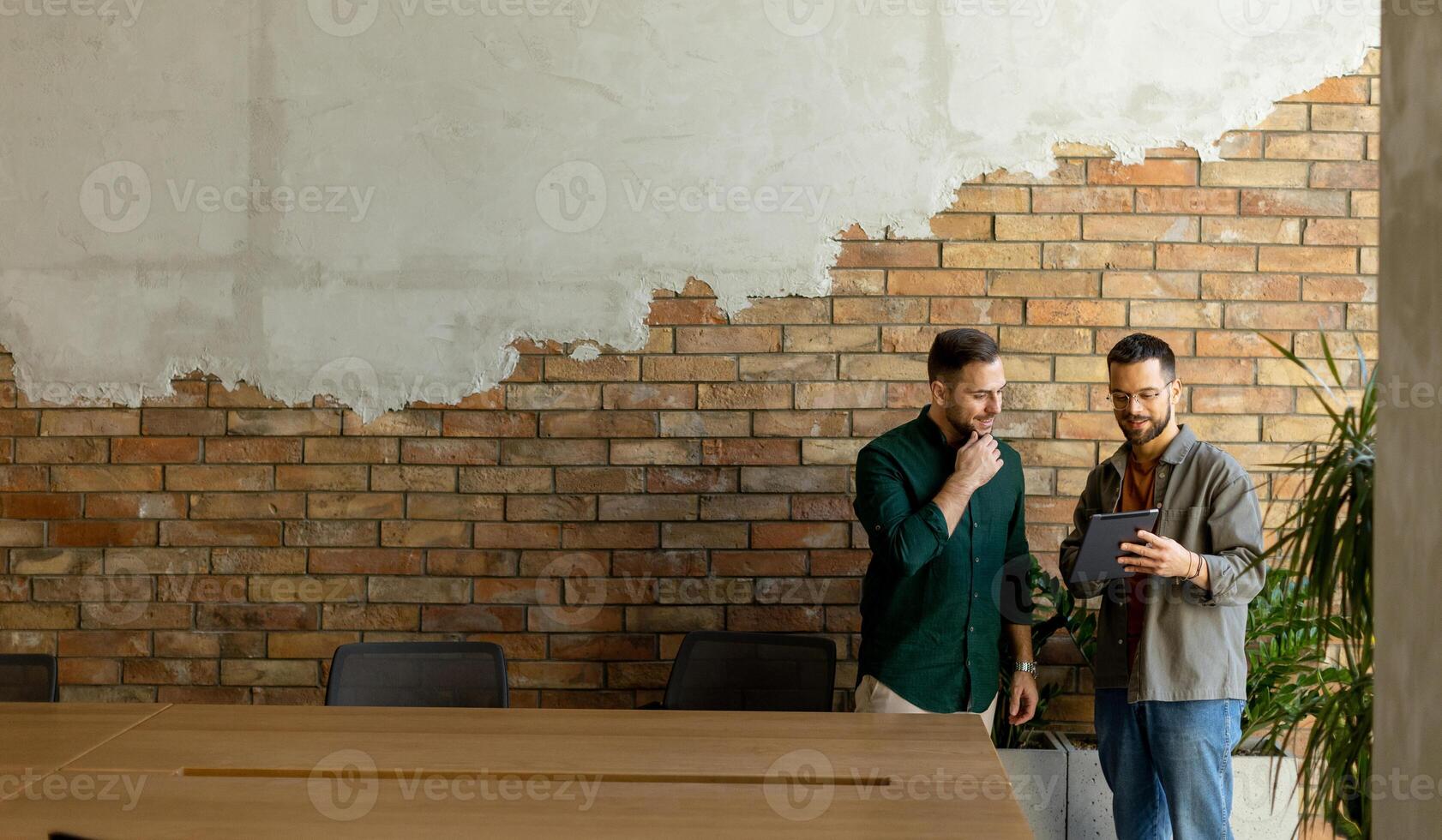 Collaborative Discussion in a Modern Office With Exposed Brick Walls photo