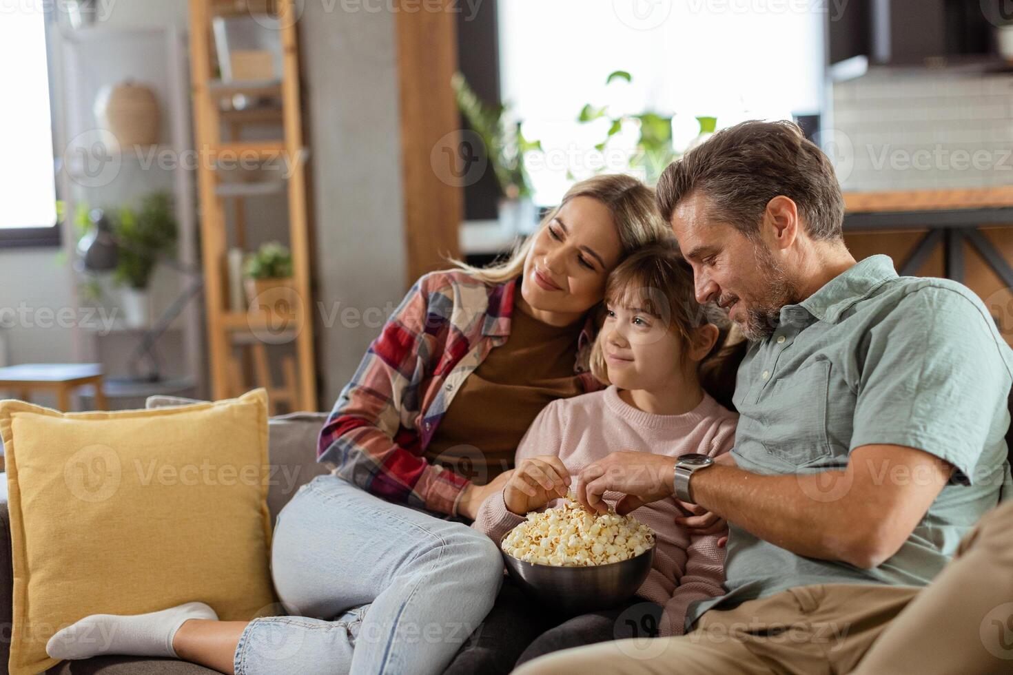 Family Movie Night, Engrossed in Thrilling Scenes at Home photo