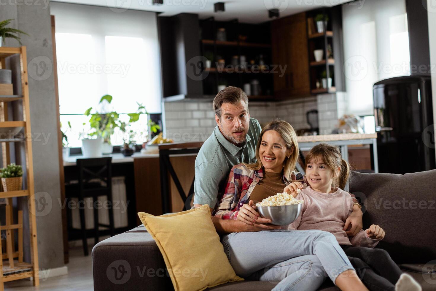 Family Movie Night, Engrossed in Thrilling Scenes at Home photo