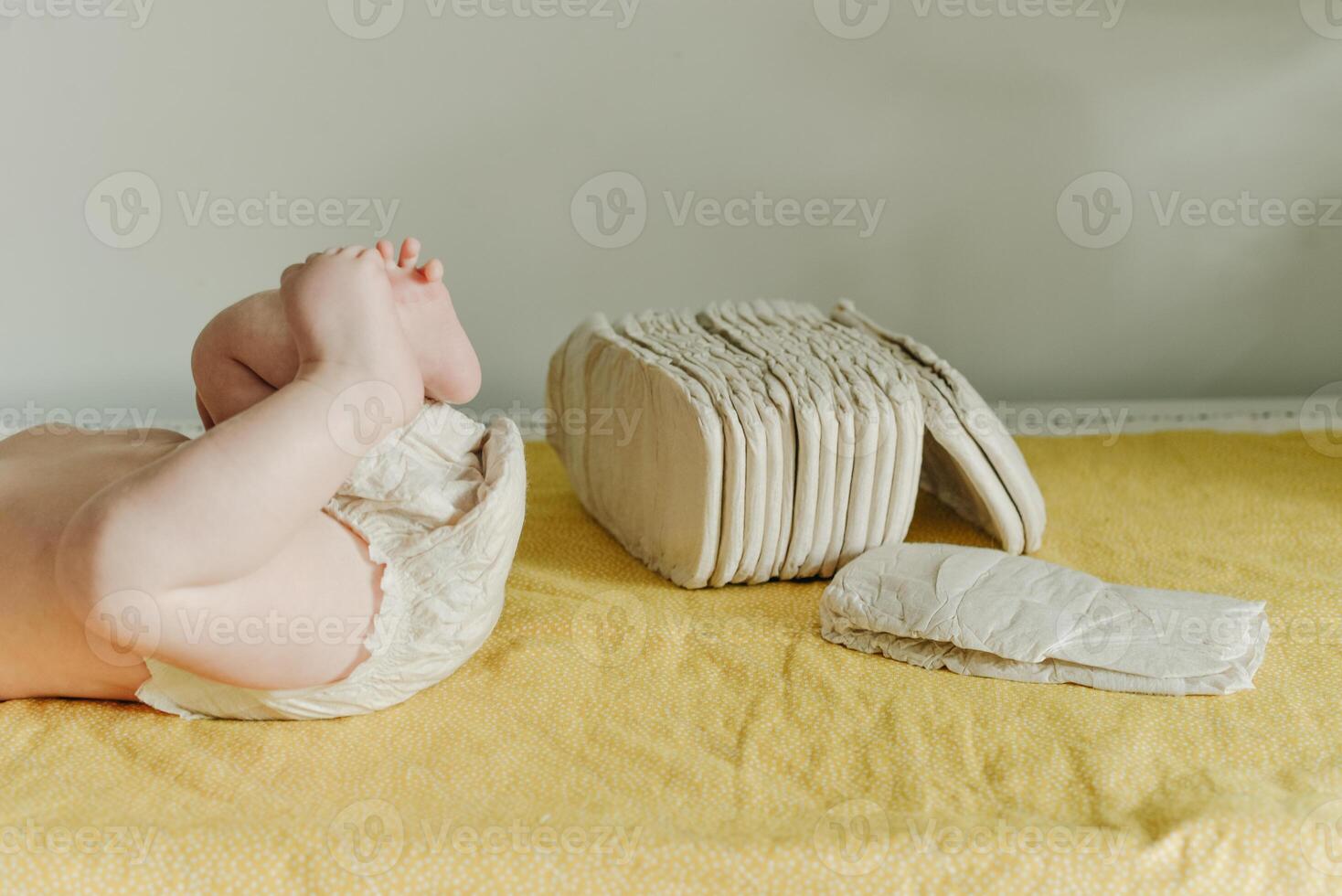 Baby wearing a white reusable nappy photo