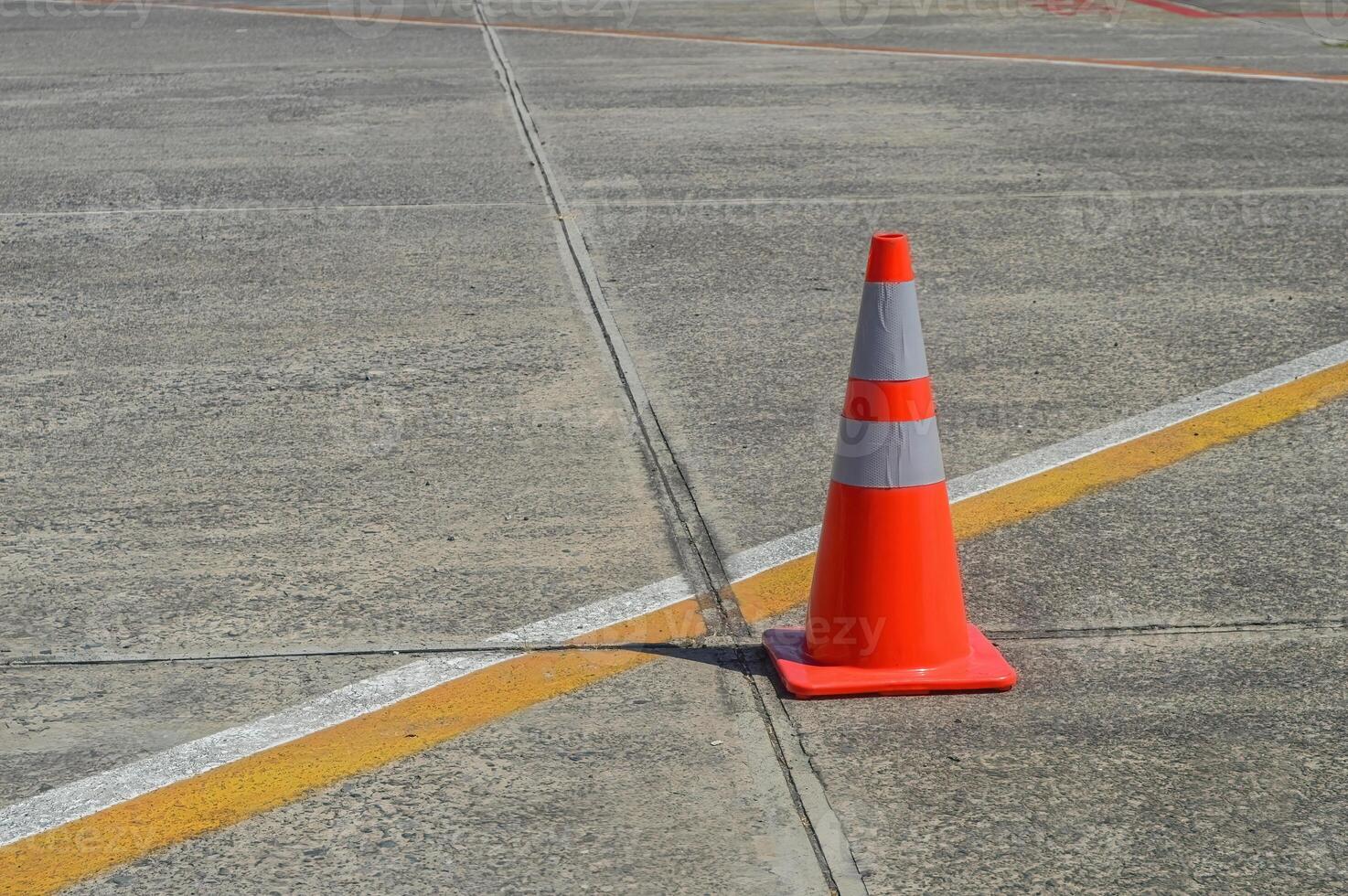 a traffic cone in the middle of the Juanda International Airport apron photo