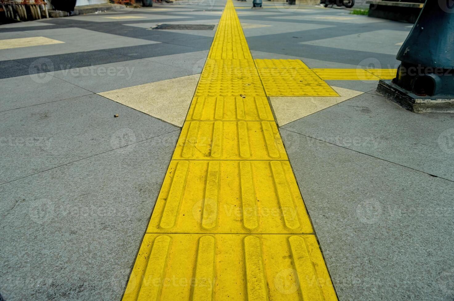 tactile paving for blind handicap on tiles pathway, walkway for blindness people. photo