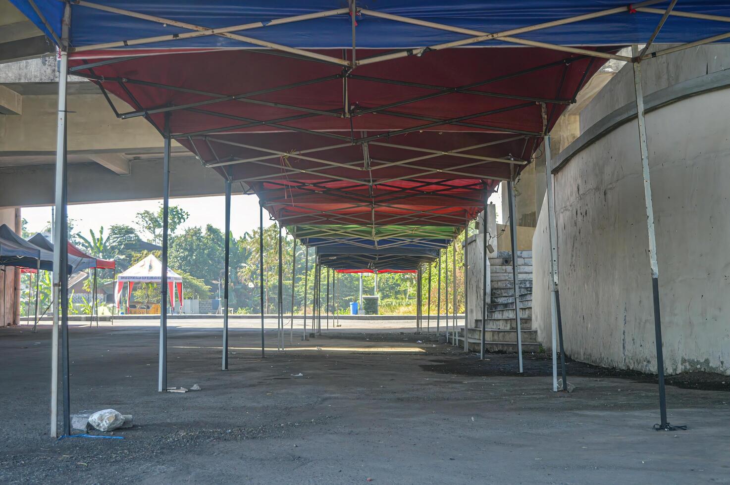 folding tents for bazaars lined up for bazaar preparation photo