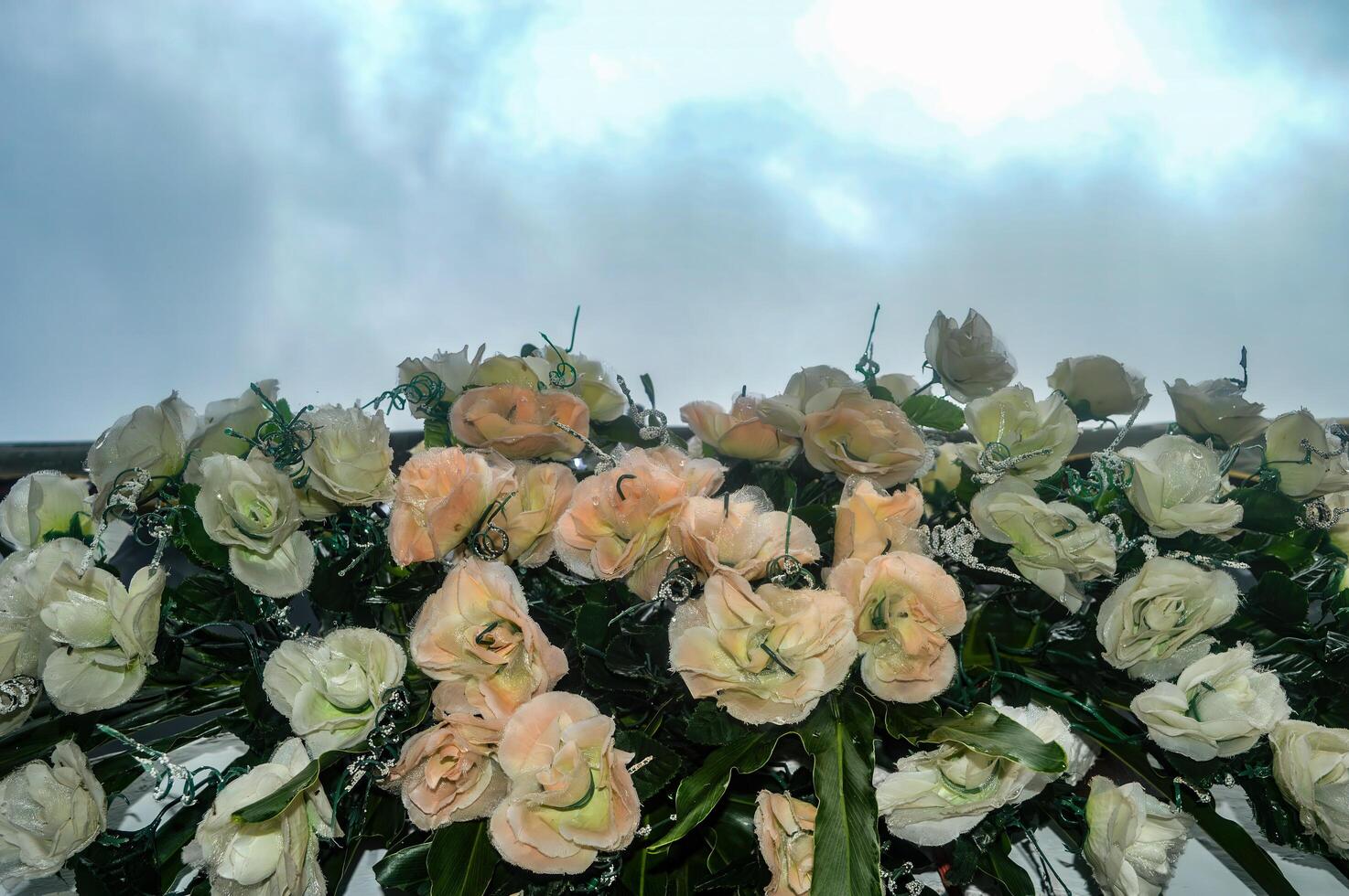 a flower arrangement on a wedding tent photo