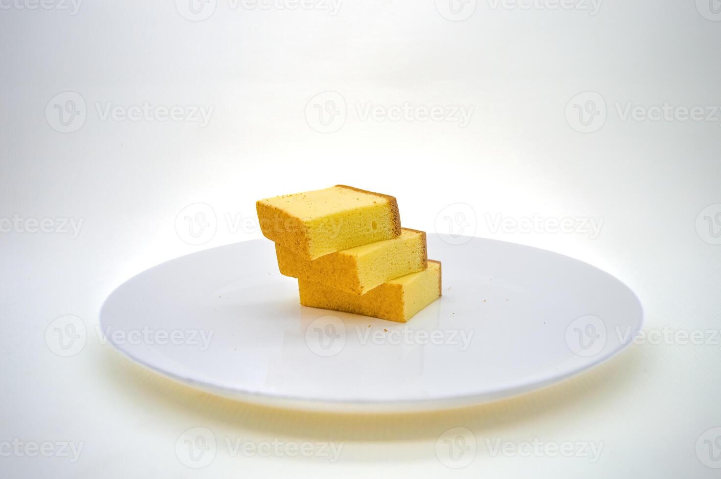 three slices of cheese cake on a white plate with a plain background photo