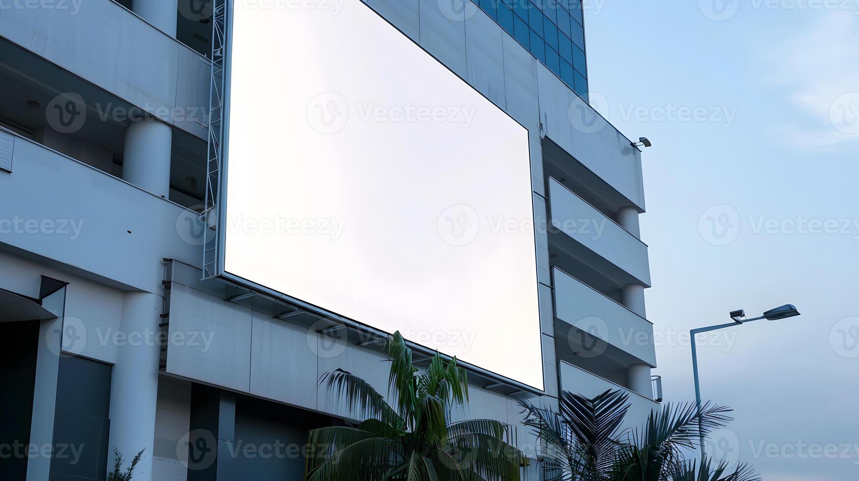 An empty huge poster mockup on the roof of a mall photo