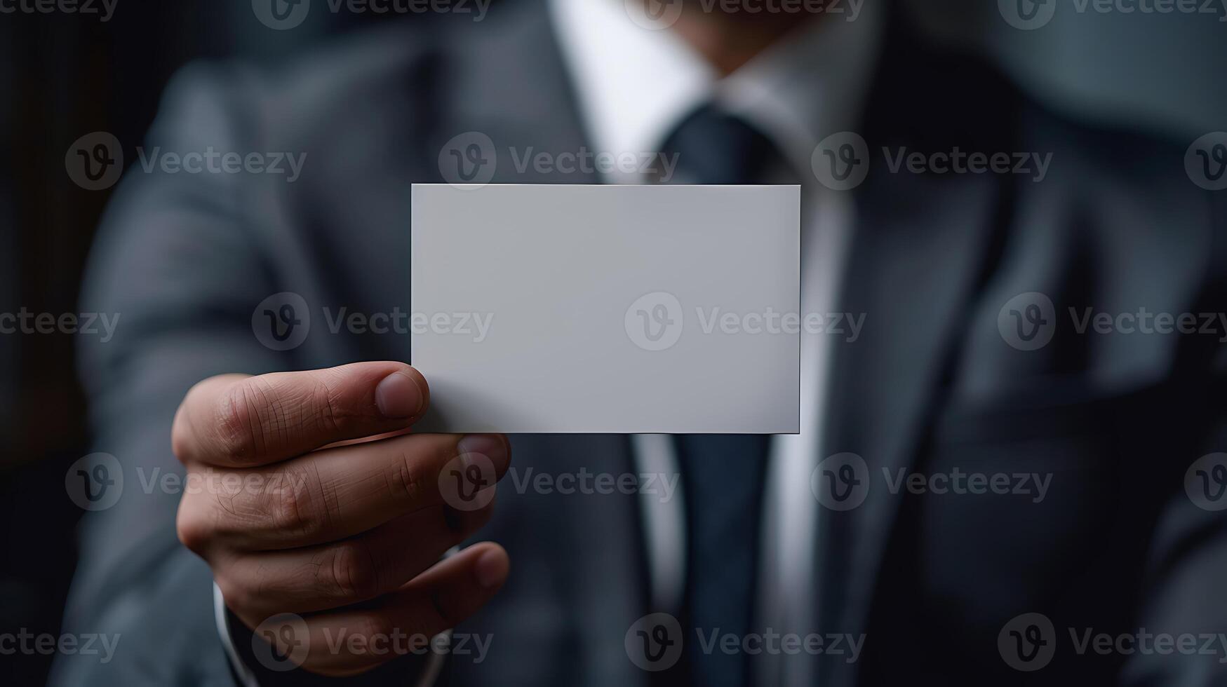 Close up hand of Businessman holding blank white card in studio photo