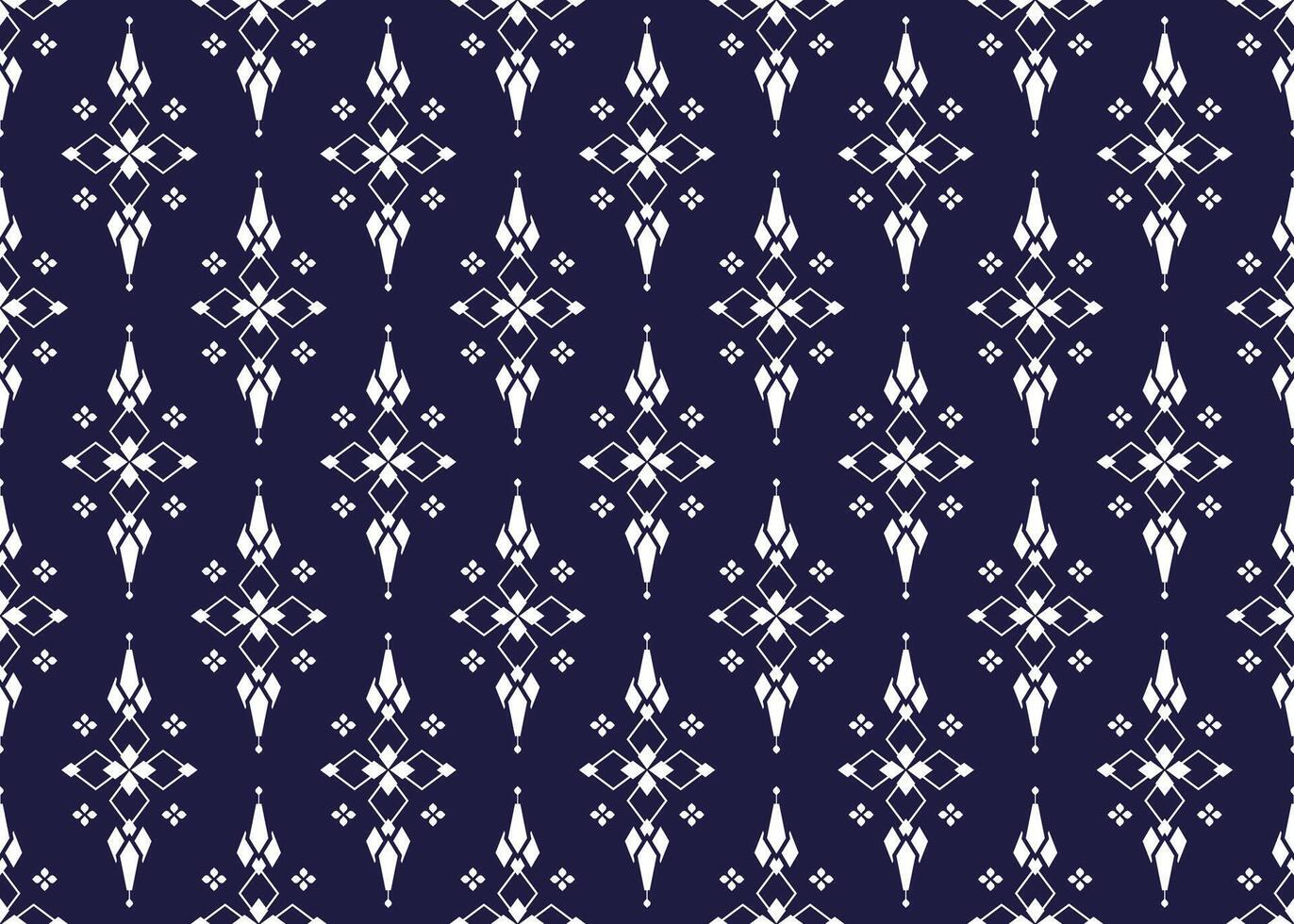 geometric and white symbol flowers form on dark blue background, ethnic fabric seamless pattern design for cloth, carpet, batik, wallpaper, wrapping etc. vector