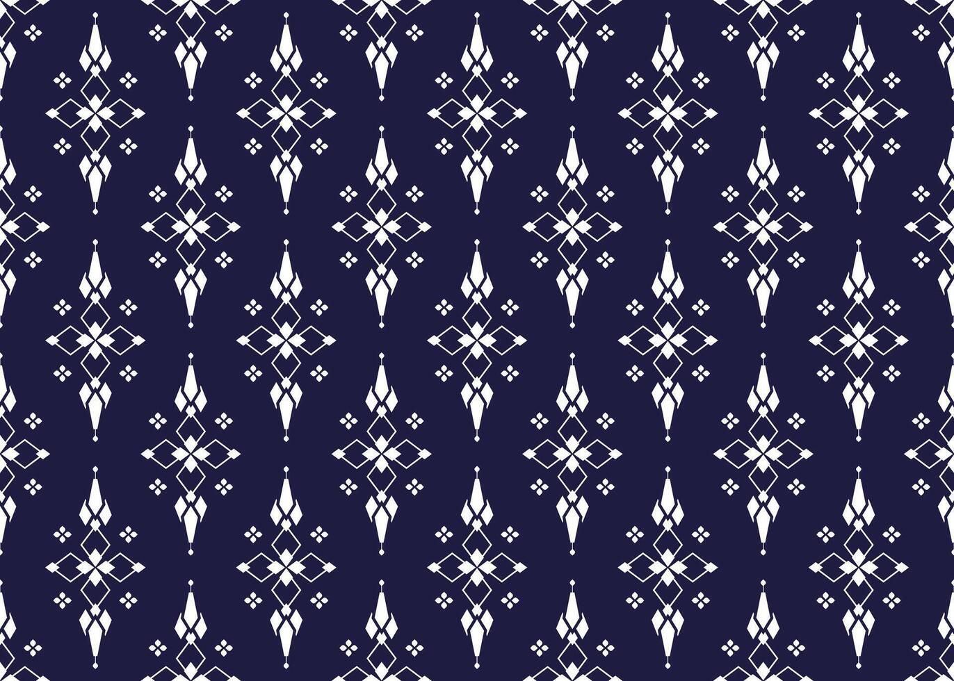 geometric and white symbol flowers form on dark blue background, ethnic fabric seamless pattern design for cloth, carpet, batik, wallpaper, wrapping etc. vector