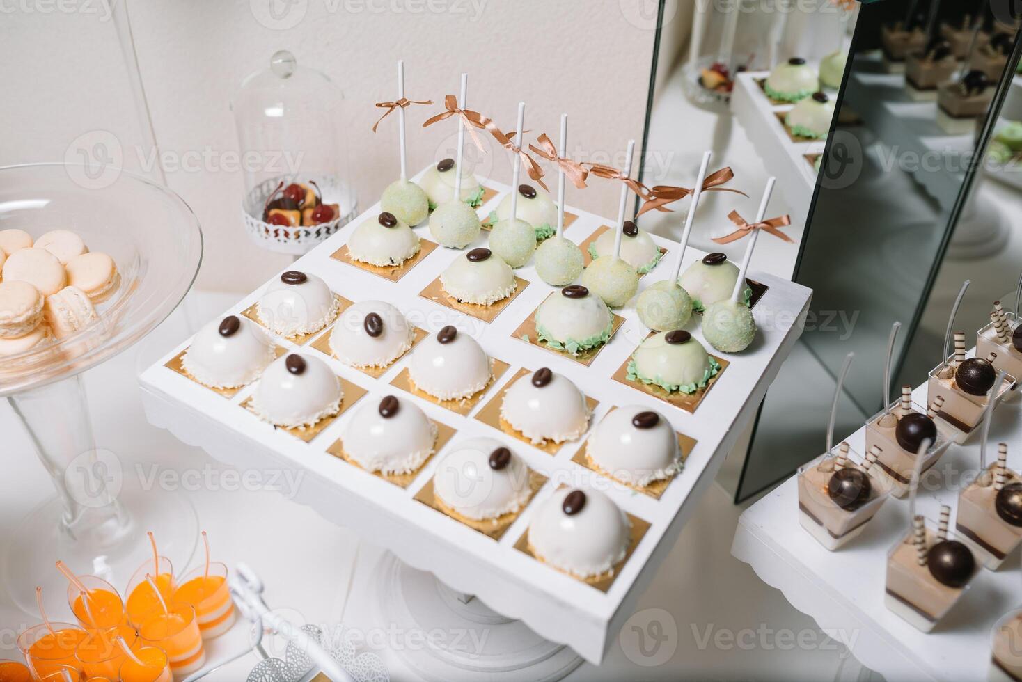 Different fruit desserts with fruits in glasses on the table. Restaurant presentation, food, party concept photo