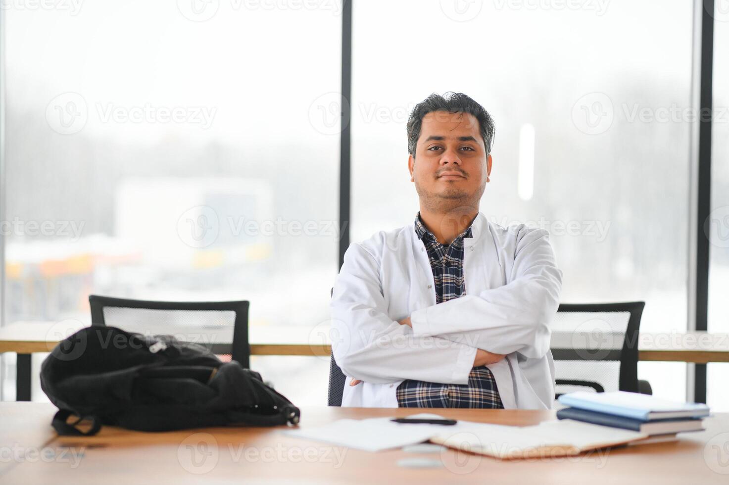 Portrait of a young doctor student studying photo