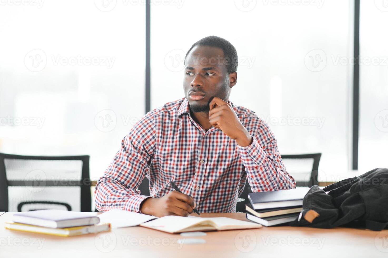 Portrait of african university student in class looking at camera photo