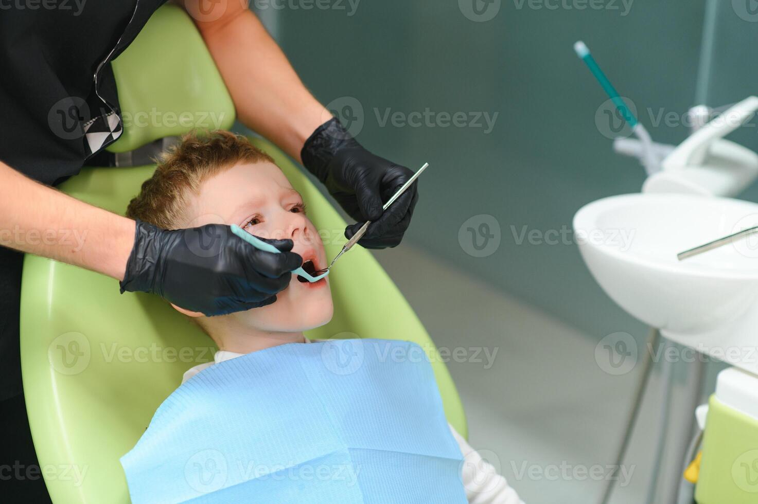 Crying and screaming little boy at the dentist photo