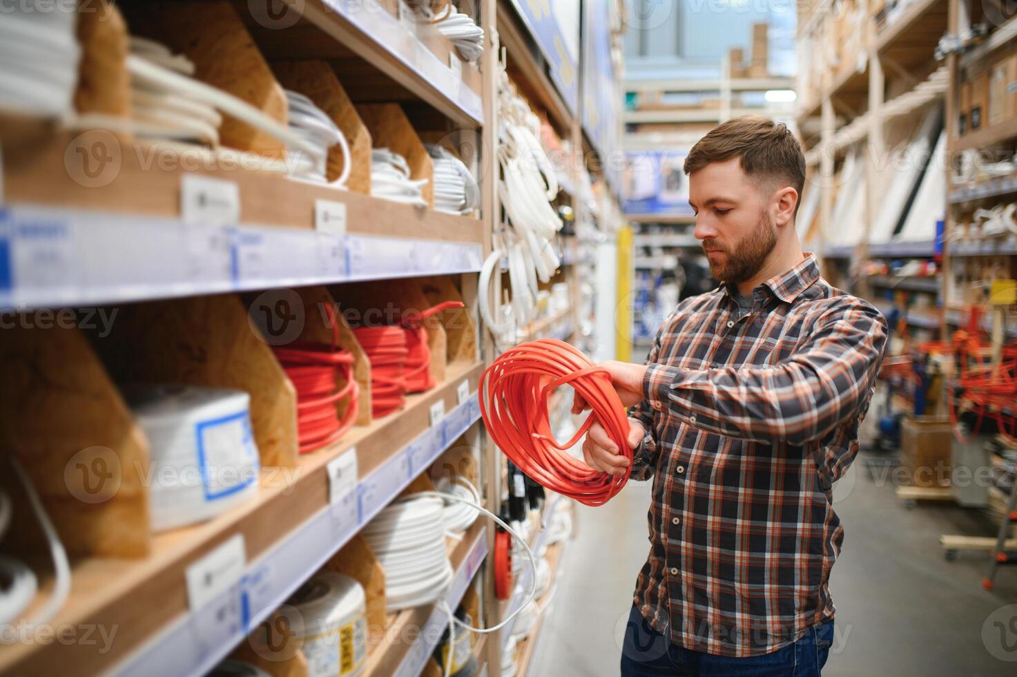 Electrician in the electrical component store. Construction industry, electrical system photo