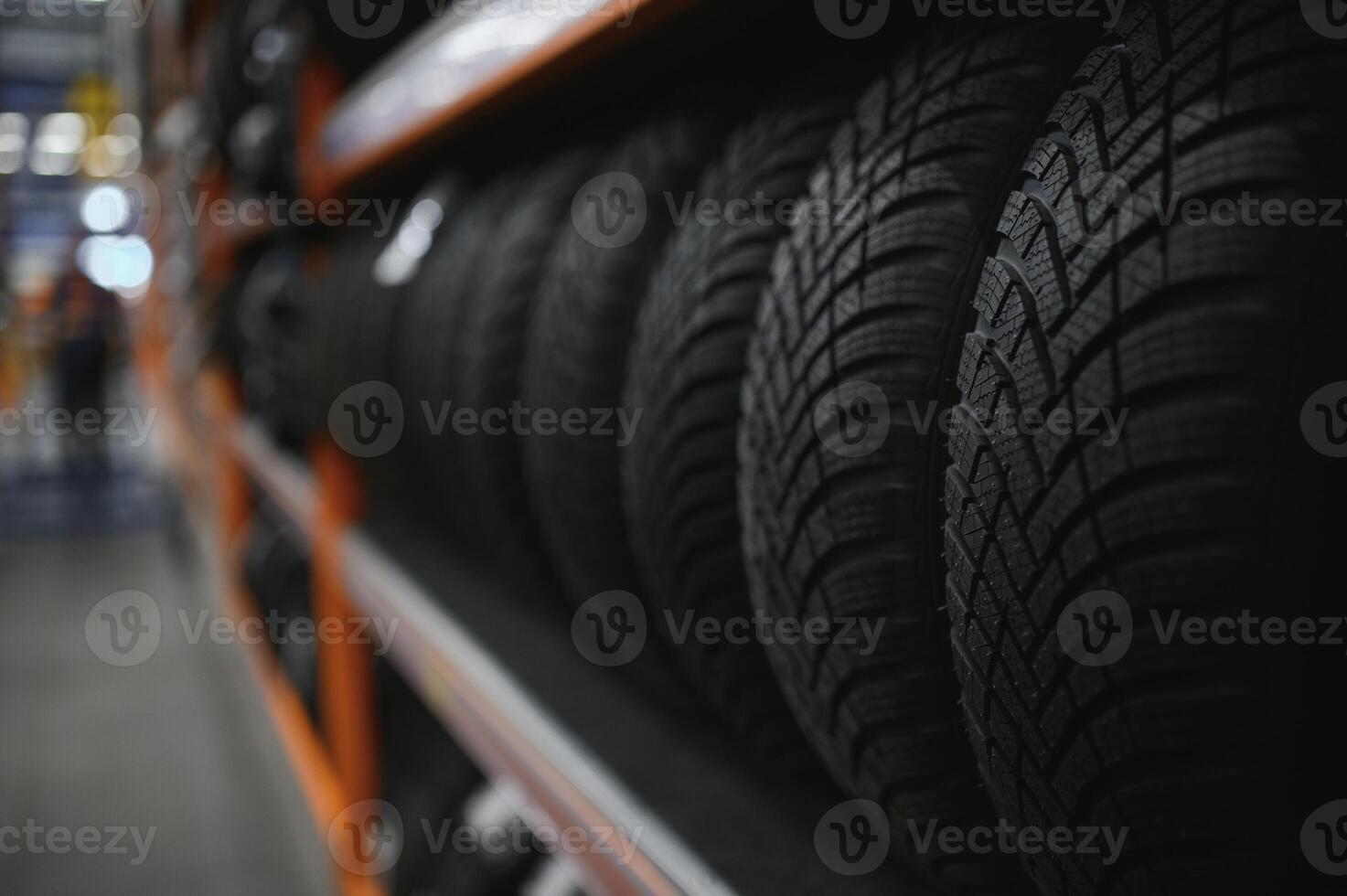Car tires at warehouse in tire store photo