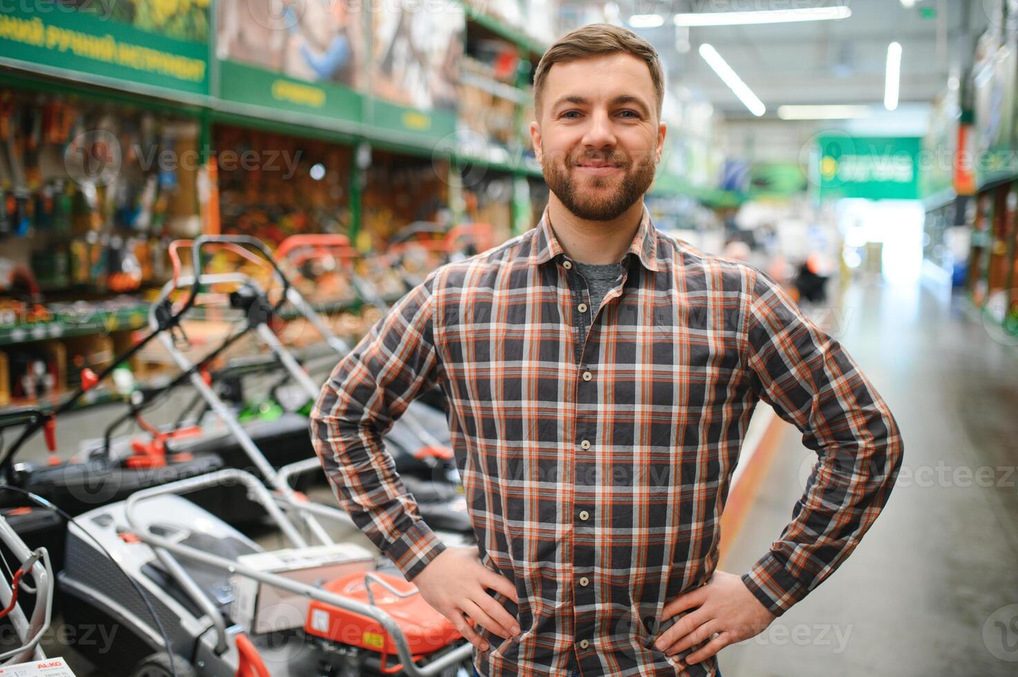 Young man working in hardware store photo