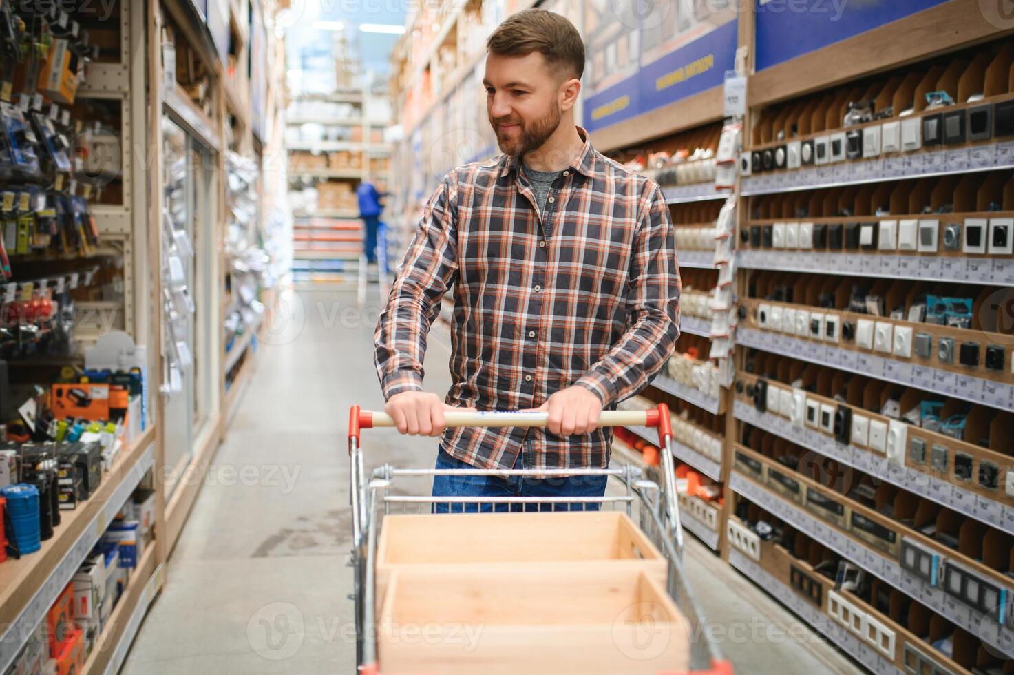 Portrait of happy mature man standing in hardware store photo