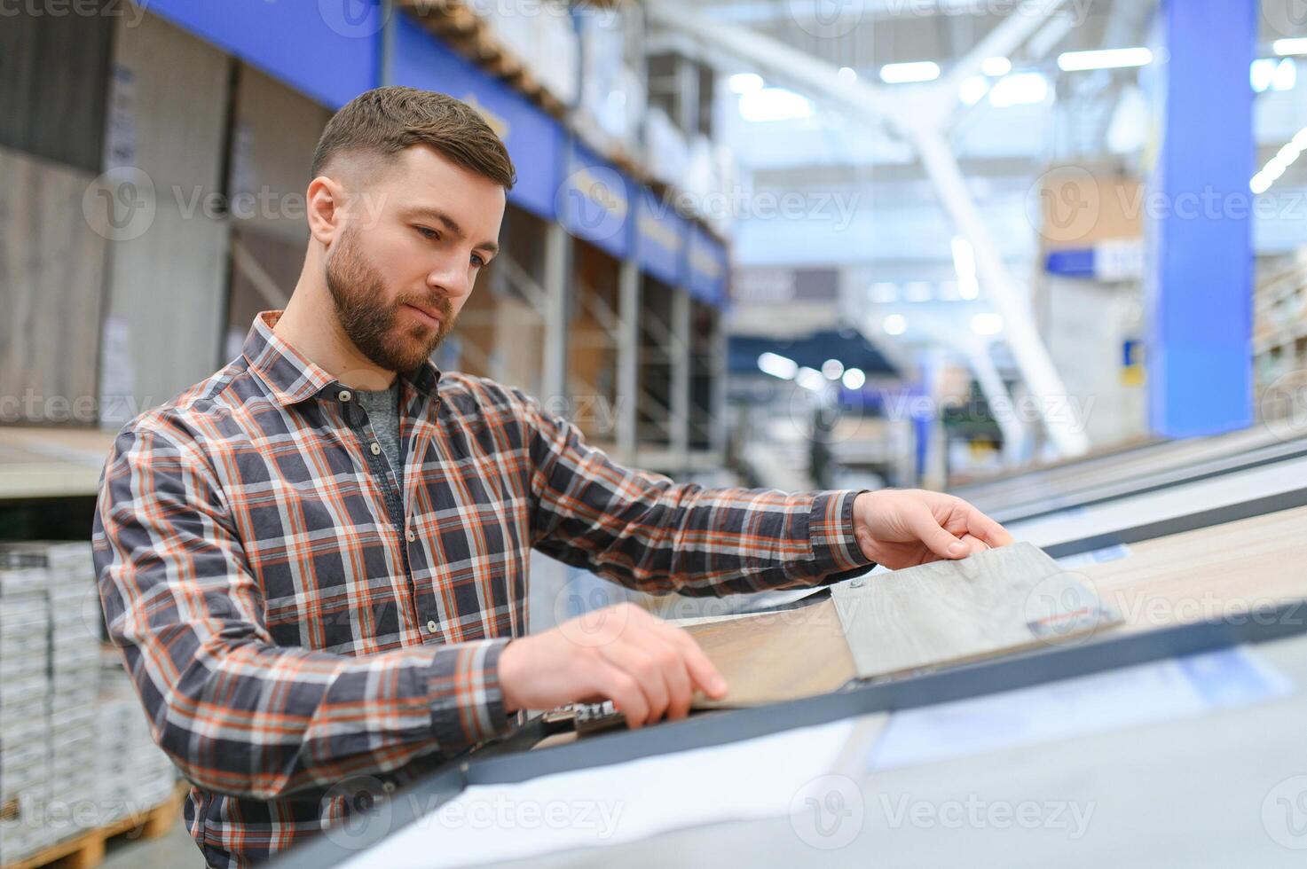 Portrait of happy mature man standing in hardware store photo