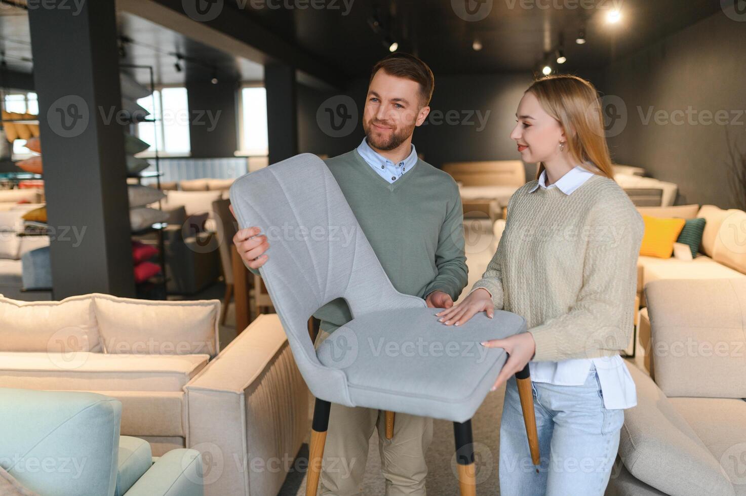 Attractive woman with her husband at the furniture store showroom photo