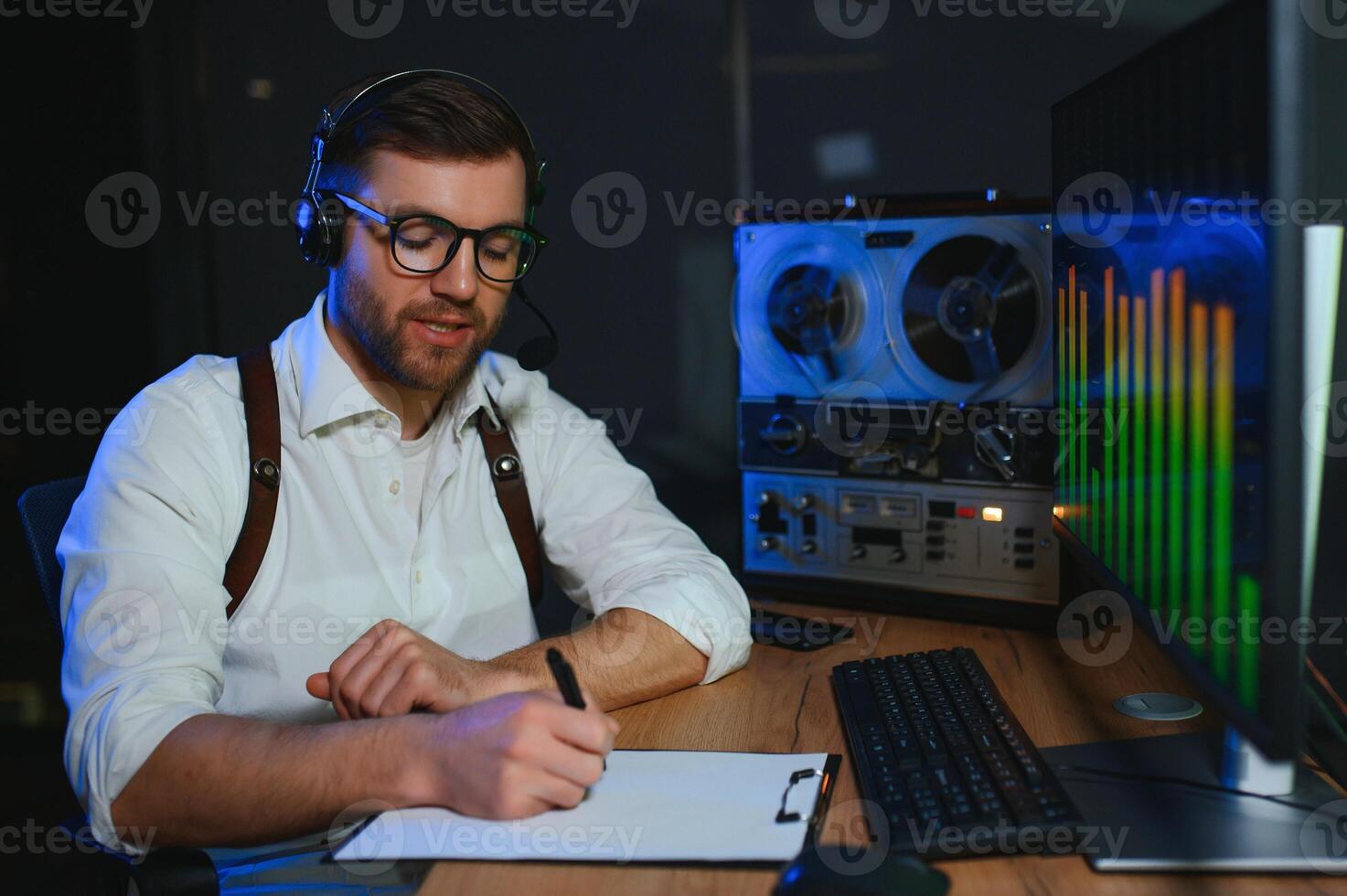 A police officer records a telephone conversation on a tape recorder. secret agent photo