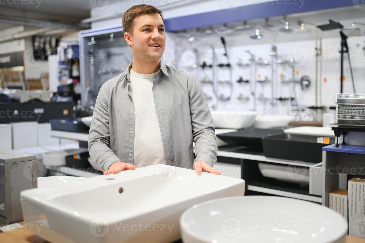 Man at the building market looking for sink into their bathroom photo